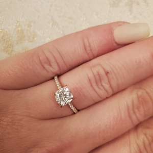 Engagement ring photos on hands with carat size more