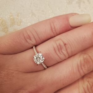 1 carat diamond ring on finger